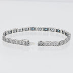 Back view of 7 1/4 inch Victorian Style 3 Stone London Blue Topaz Filigree Bracelet in Fine Sterling Silver showing 925 sterl