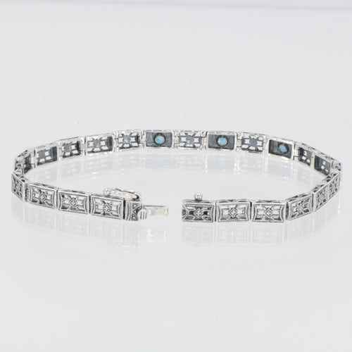 Back view of 7 1/4 inch Victorian Style 3 Stone London Blue Topaz Filigree Bracelet in Fine Sterling Silver showing 925 sterl