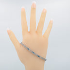 Detail view of 7 1/4 inch Victorian Style 3 Stone London Blue Topaz Filigree Bracelet in Fine Sterling Silver highlighting Bl