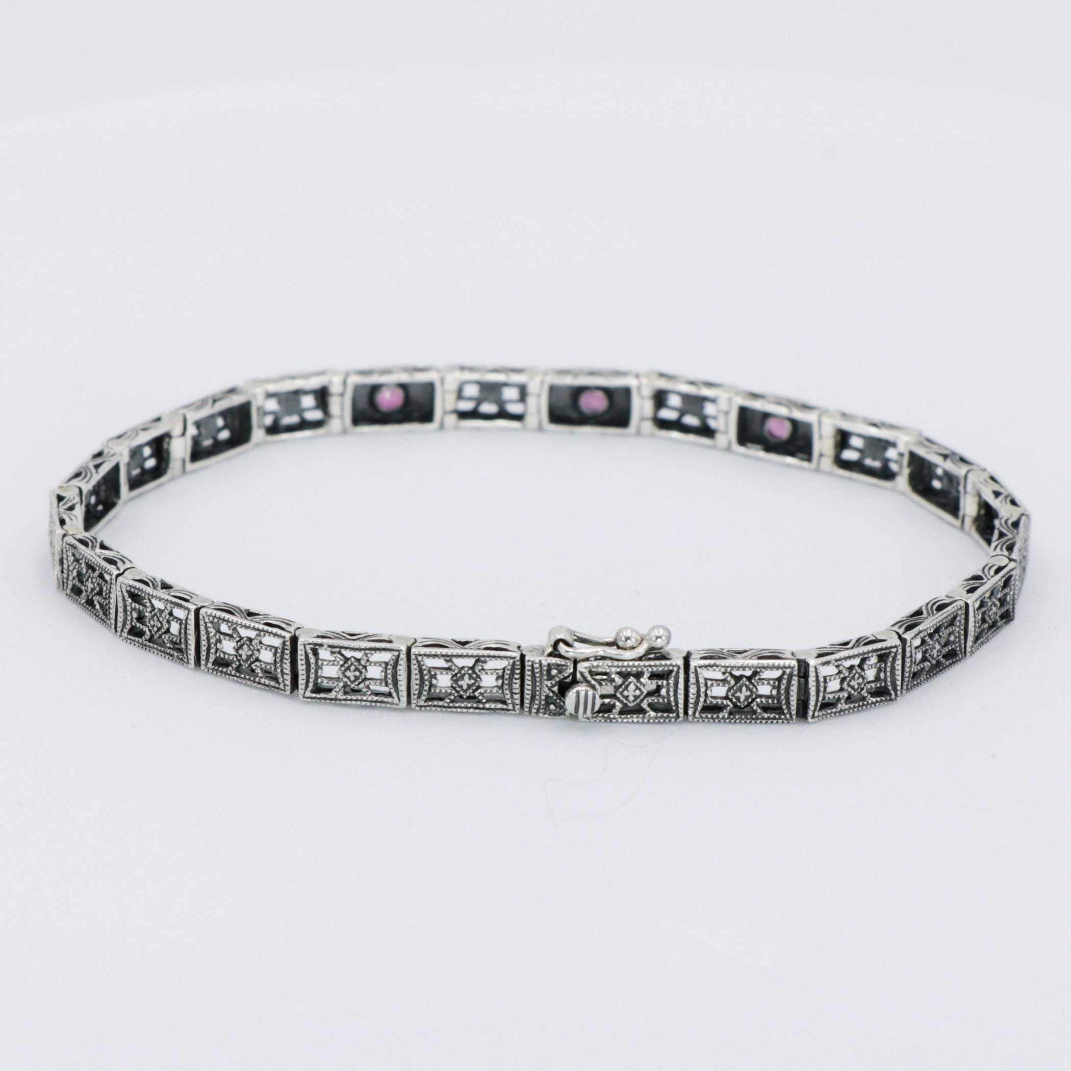Back view of Victorian Style 3 Stone Natural Red Ruby Filigree Bracelet in Fine Sterling Silver showing 925 sterling silver h