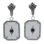 Camphor glass drop earrings with blue sapphire center, milgrain marcasite border, art deco fleur post, sterling silver