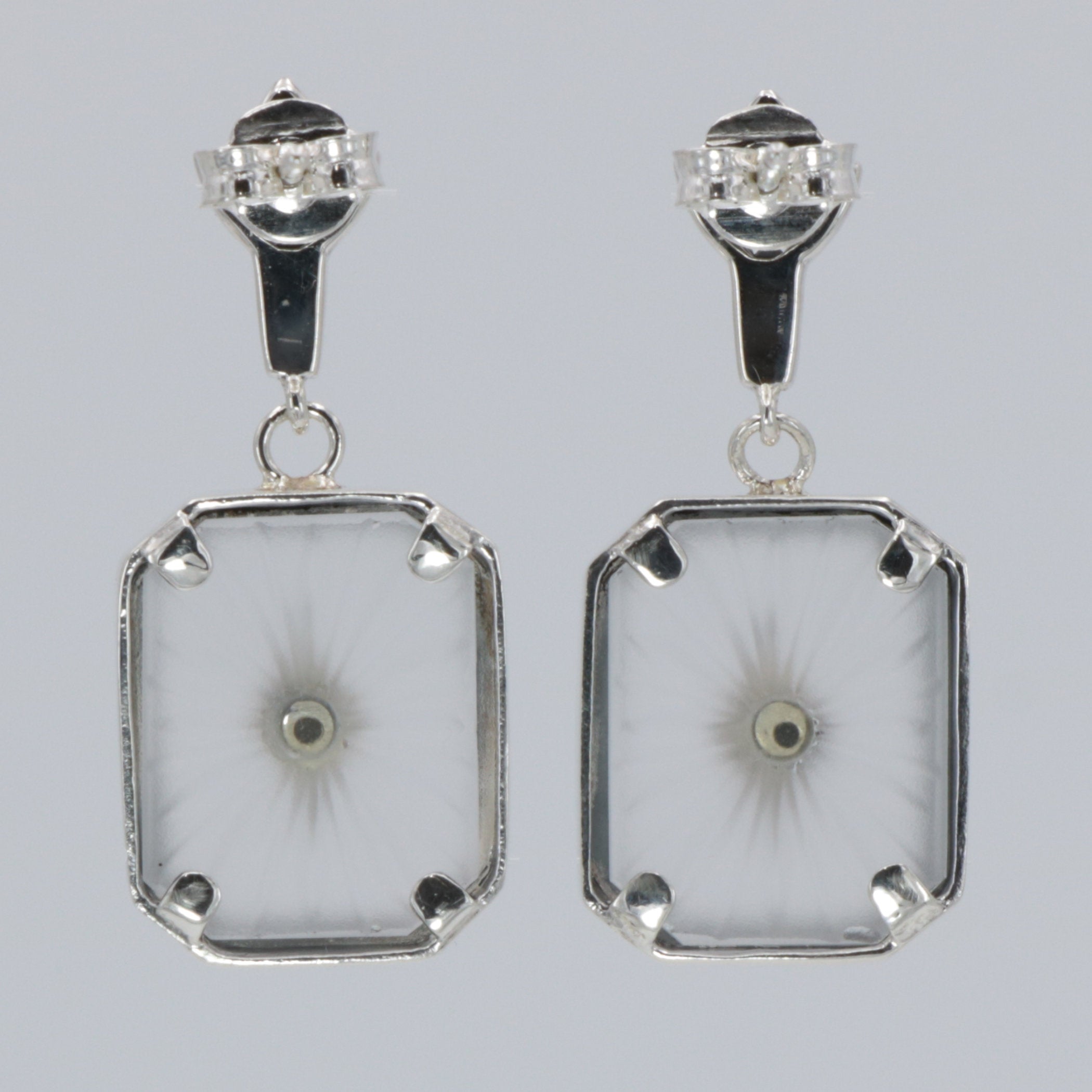 Back view of Antique Style Camphor Glass Earrings with Blue Sapphire Center showing 925 sterling silver hallmark and French wire hooks