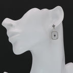 Detail view of Antique Style Camphor Glass Earrings with Blue Sapphire Center highlighting camphor glass detail