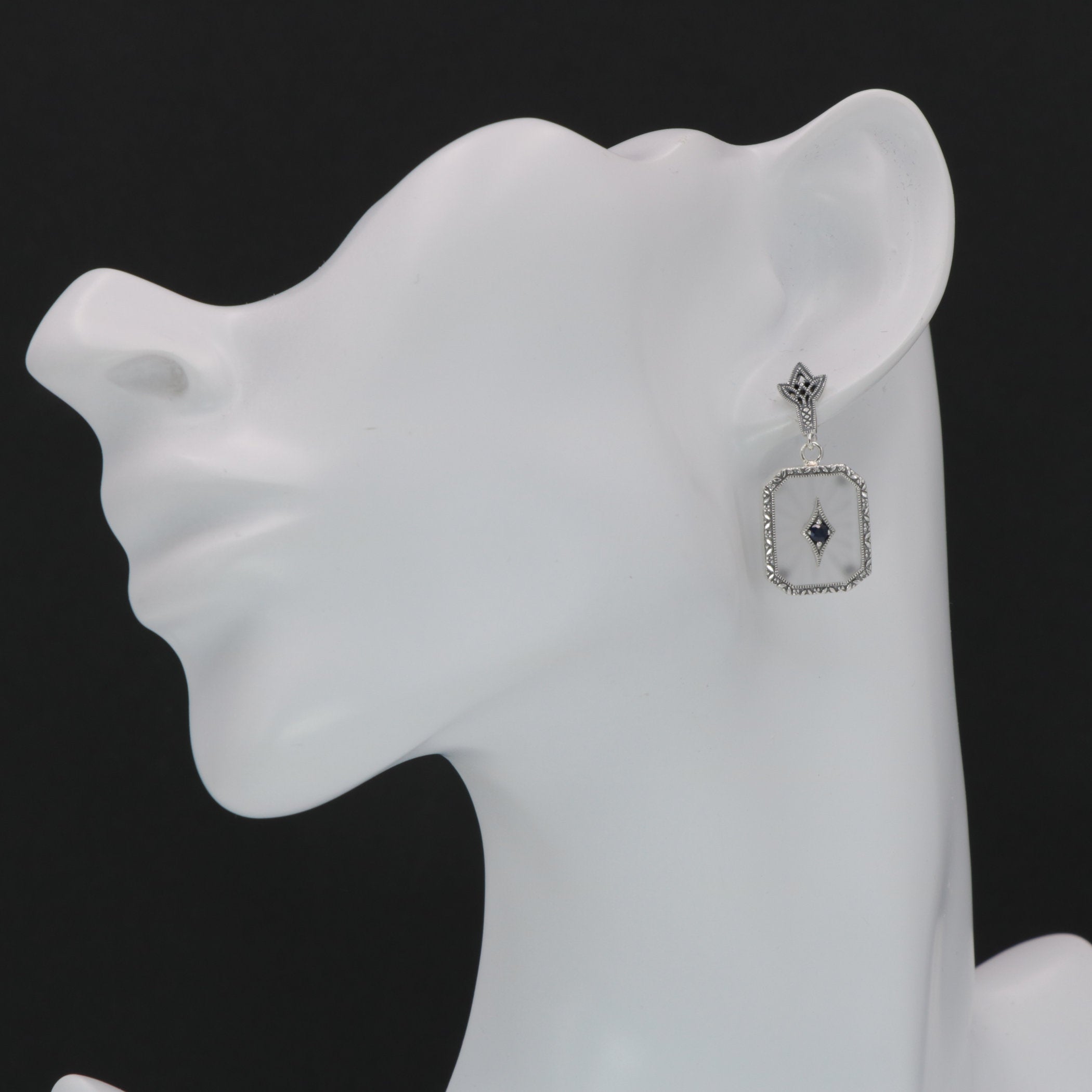 Detail view of Antique Style Camphor Glass Earrings with Blue Sapphire Center highlighting camphor glass detail