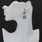 Detail view of Art Deco Style London Blue Topaz Two Tiered Earrings highlighting topaz detail