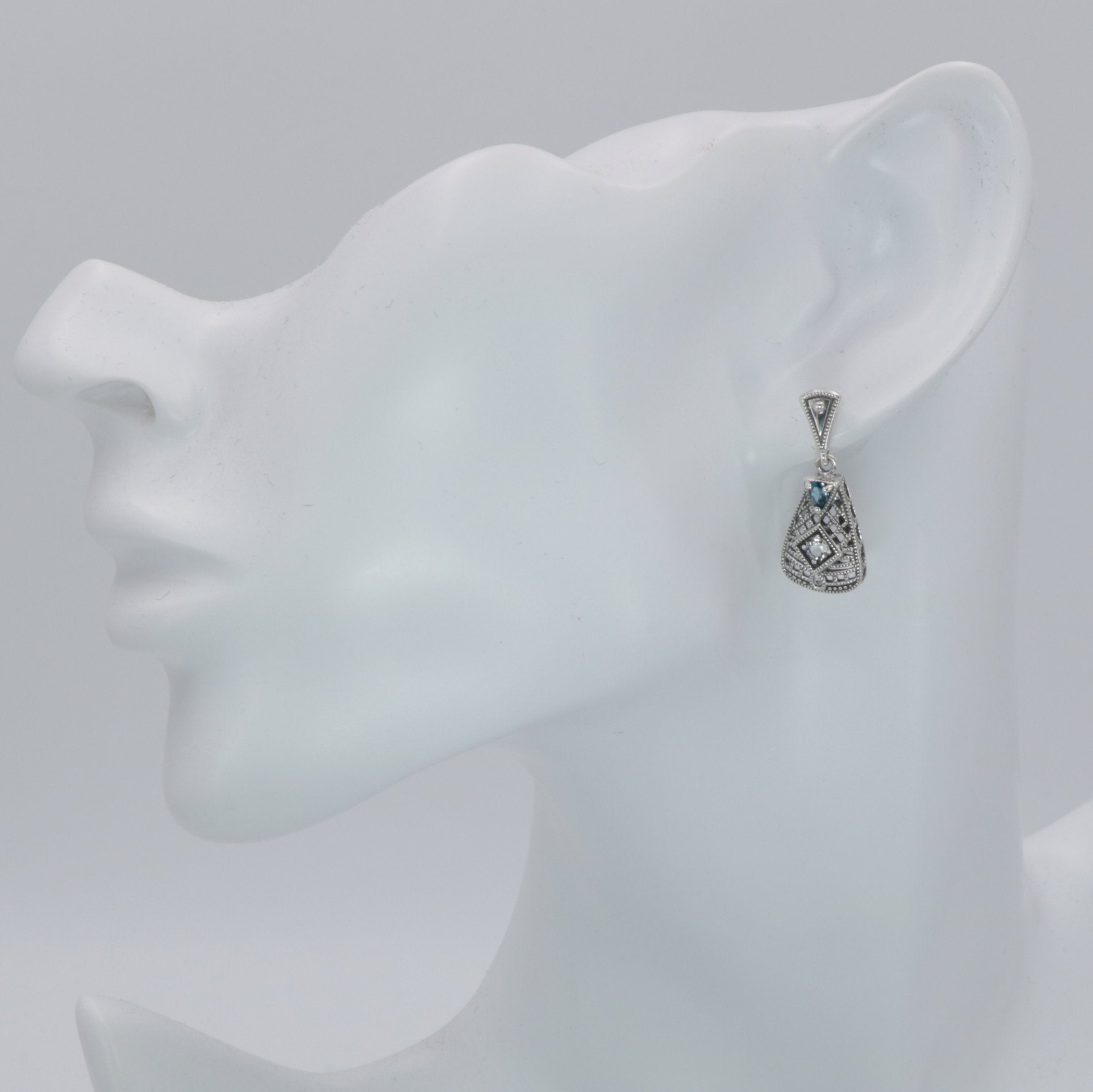 Detail view of Art Deco London Blue Topaz and White Topaz Filigree Earrings highlighting filigree detail