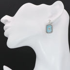 Detail view of Art Deco Style Filigree Earrings Teal Pressed Glass Crystal Diamond Accents highlighting filigree detail