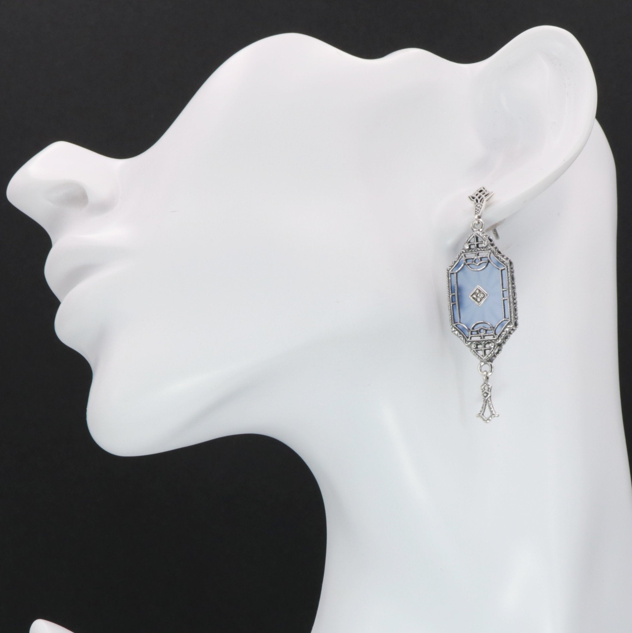 Detail view of Art Deco Style Blue Sunray Crystal Dangle Filigree Earrings Diamond Accent highlighting filigree detail