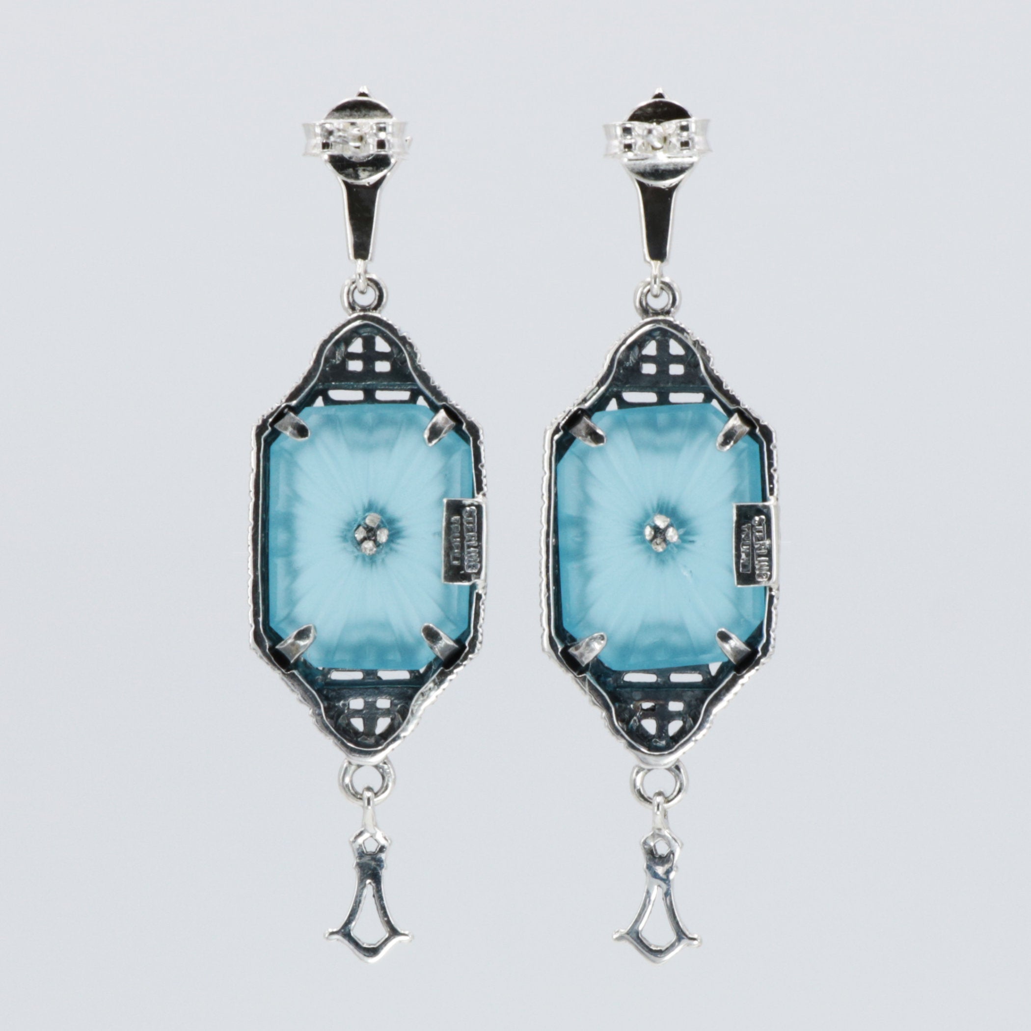 Back view of Art Deco Style Teal Sunray Crystal Dangle Filigree Earrings Diamond Accent showing 925 sterling silver hallmark and French wire hooks
