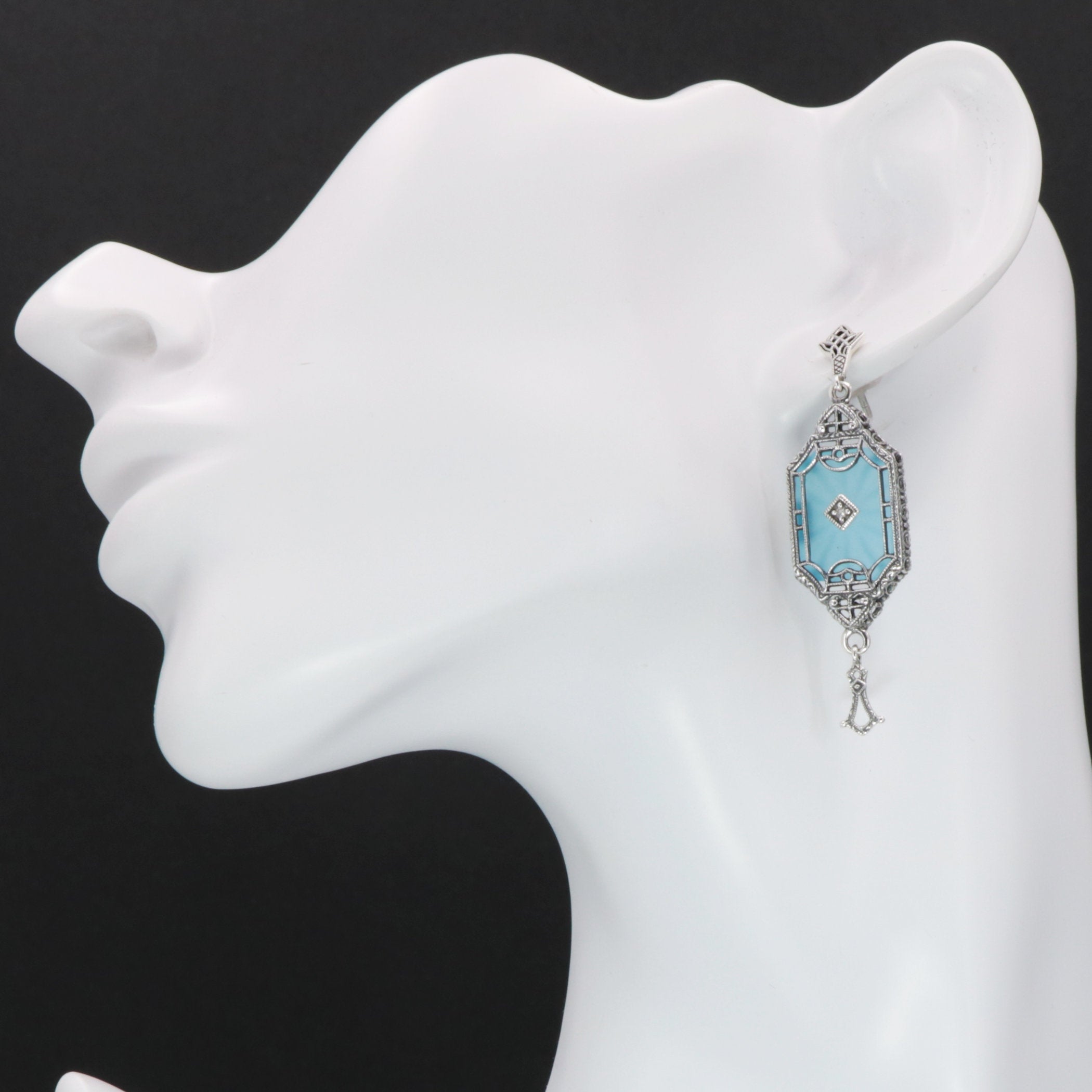 Detail view of Art Deco Style Teal Sunray Crystal Dangle Filigree Earrings Diamond Accent highlighting filigree detail