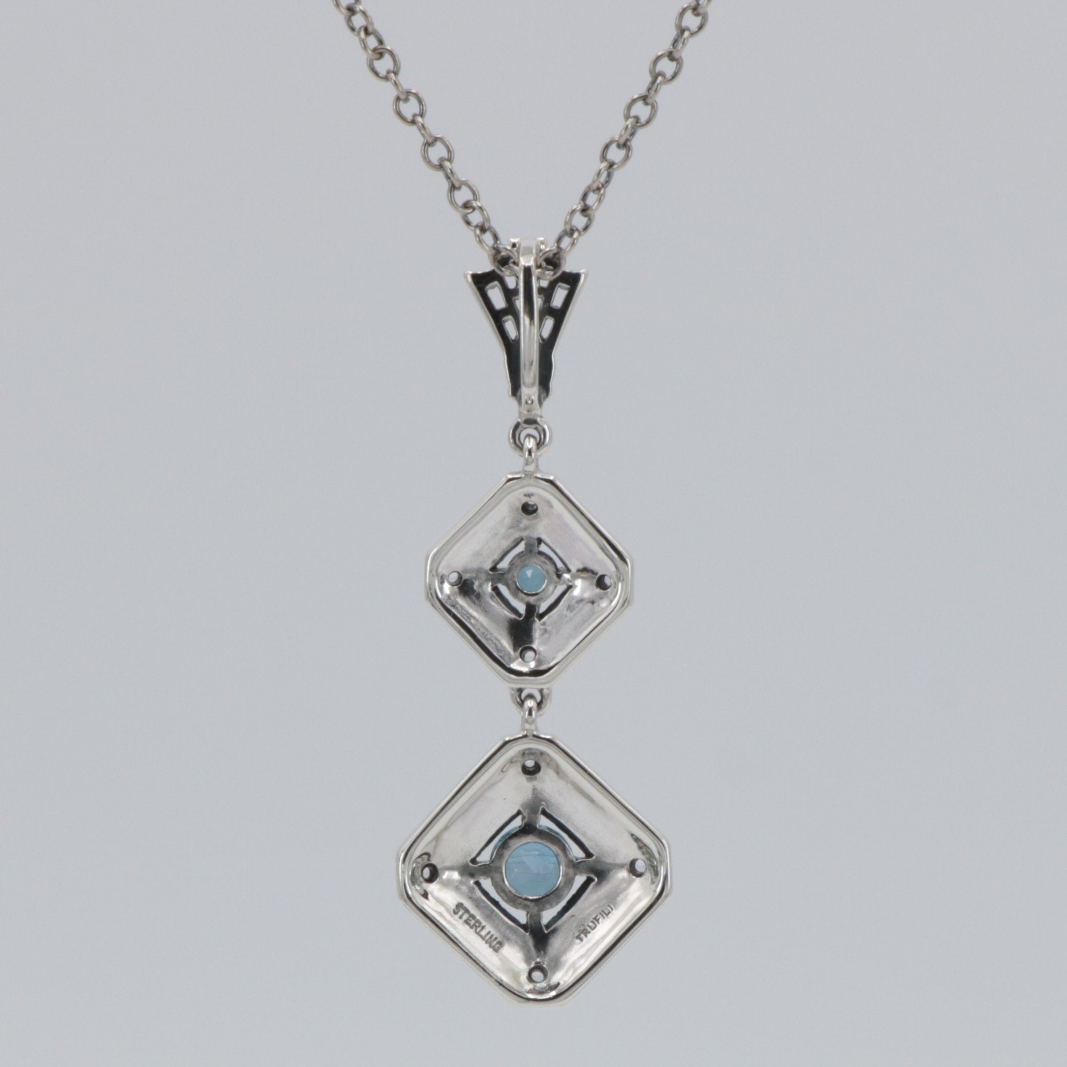 Back view of Art Deco Style Genuine London Blue Topaz and Filigree Necklace showing 925 sterling silver hallmark and spring r