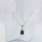 Detail view of Art Deco Style Black Onyx and Diamond Pendant and Chain highlighting Diamond, Black Onyx