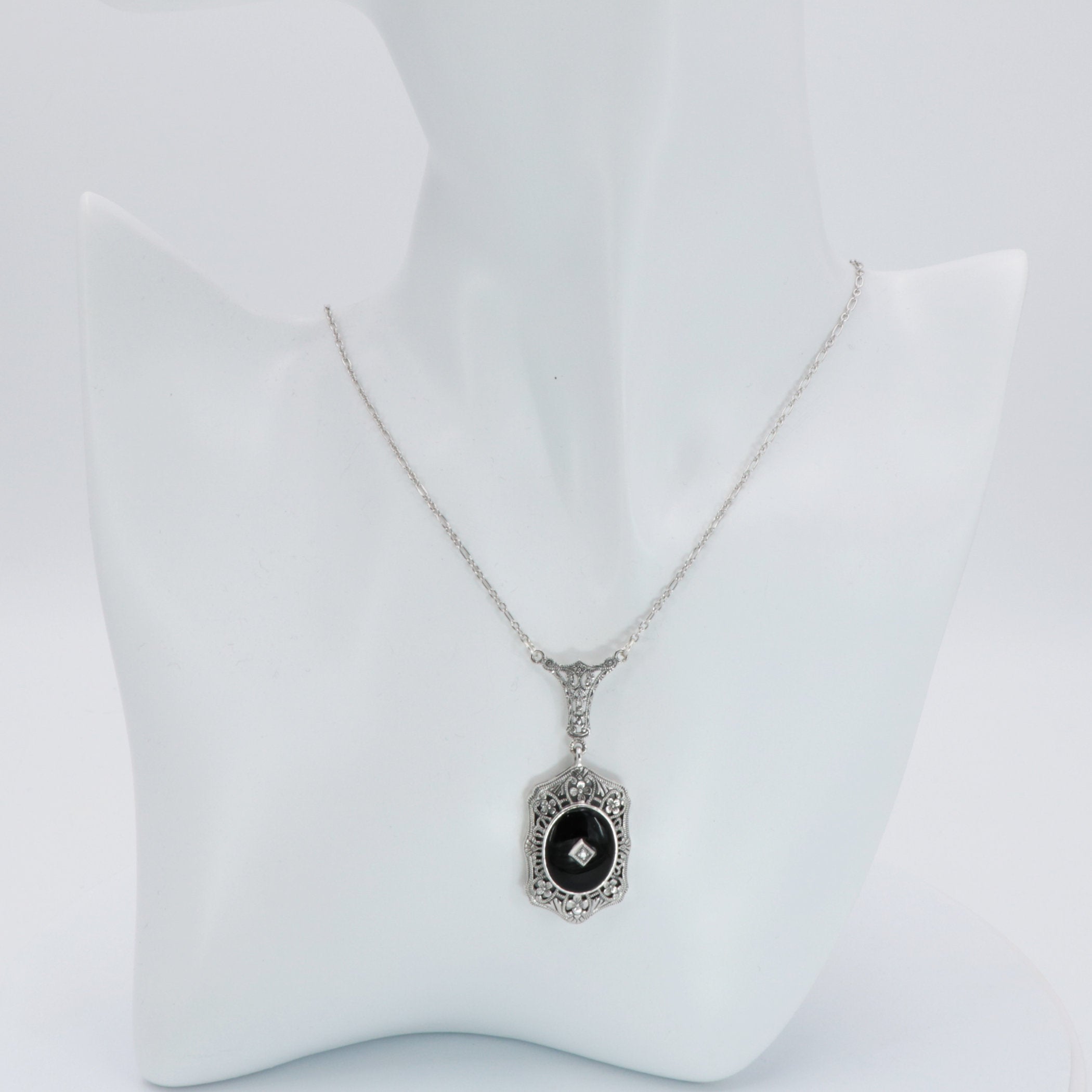 Detail view of Art Deco Style Black Onyx and Diamond Pendant and Chain highlighting Diamond, Black Onyx