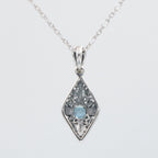 Back view of Art Deco Style London Blue Topaz Filigree Pendant with Chain showing 925 sterling silver hallmark and spring rin