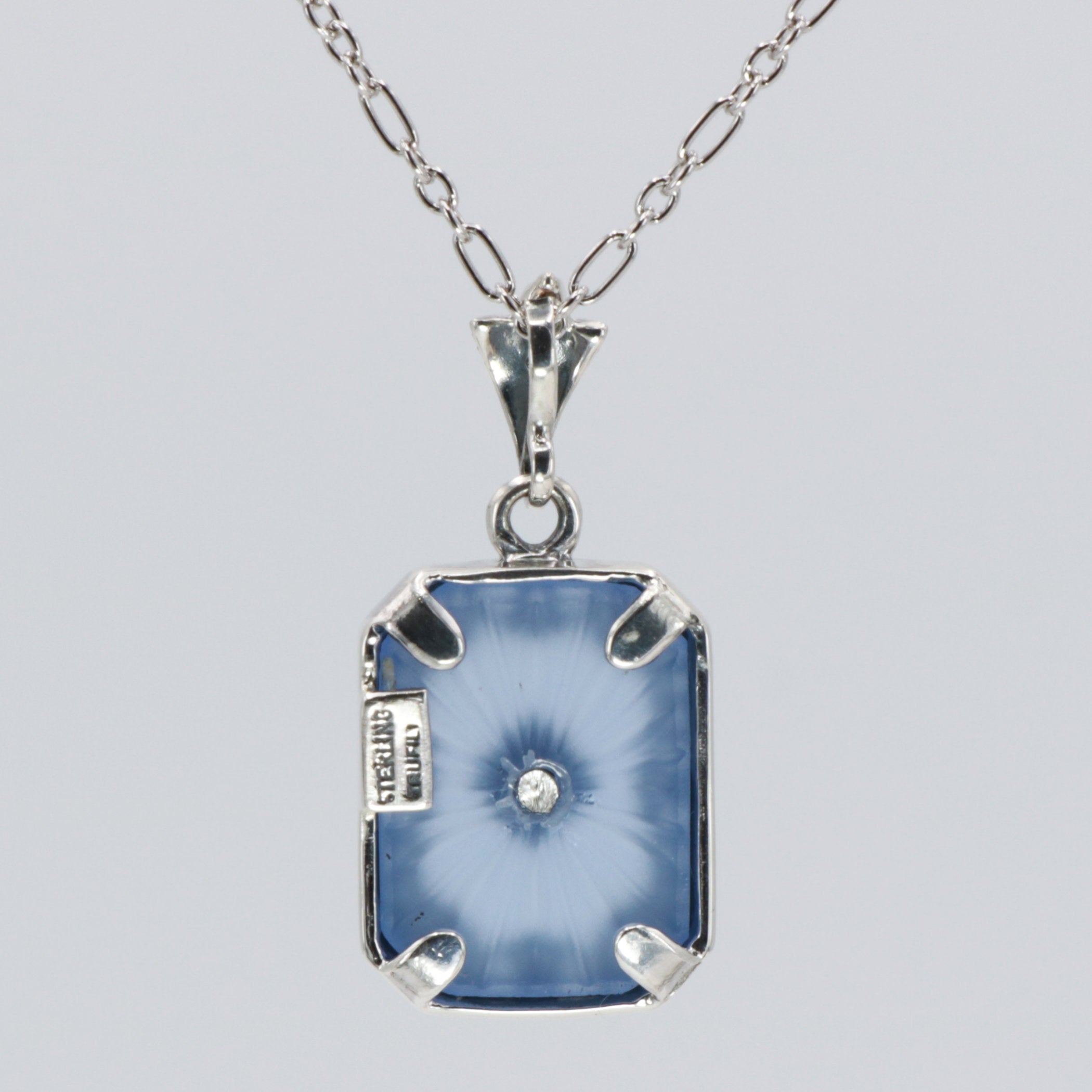 Back view of Art Deco Style Filigree Pendant Blue Pressed Glass Crystal Diamond Accents Sterling Silver showing 925 sterling 