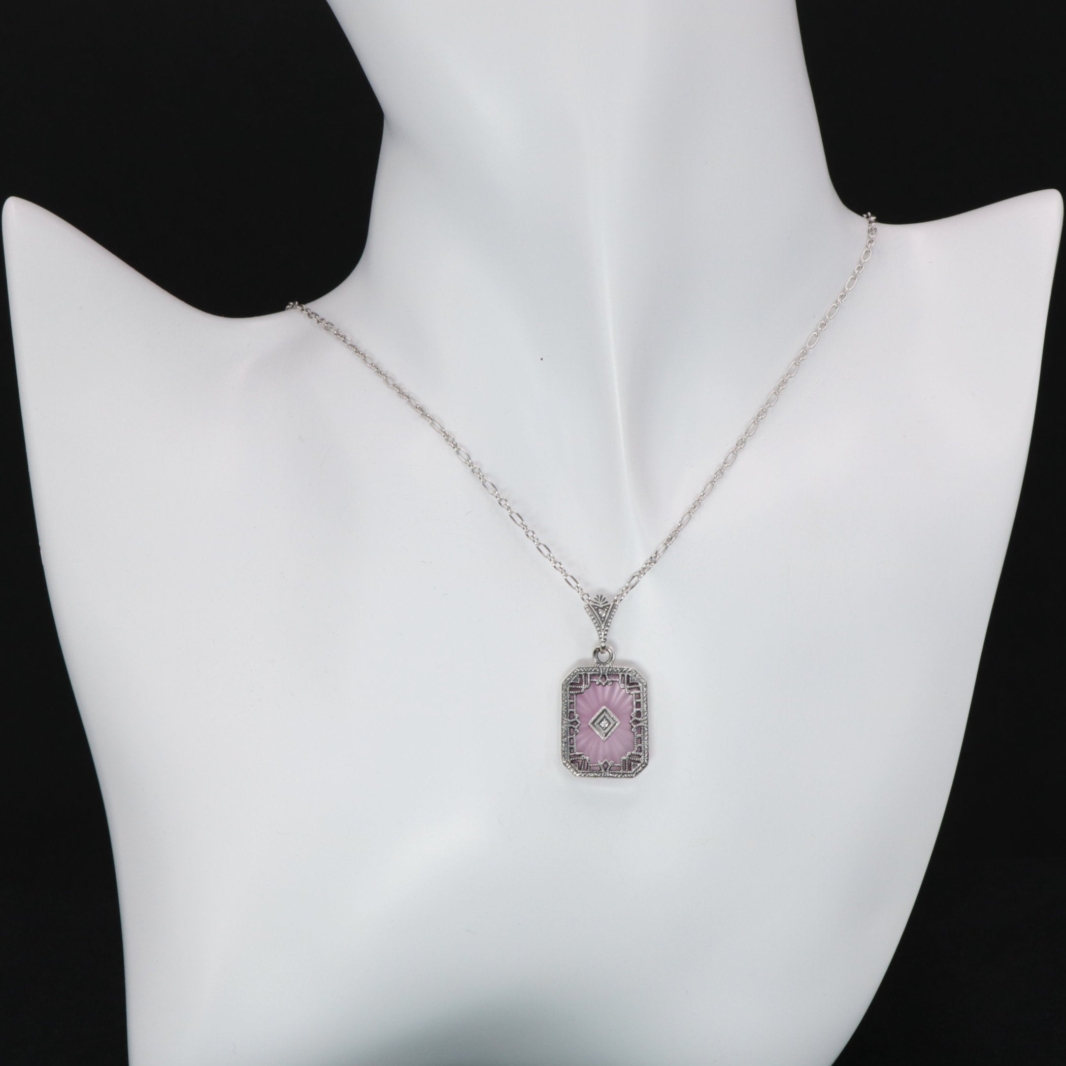 Detail view of Art Deco Style Filigree Pendant Pink Pressed Glass Crystal Diamond Accents Sterling Silver highlighting Diamon