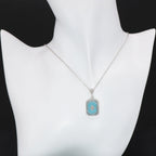 Detail view of Art Deco Style Filigree Pendant Teal Pressed Glass Crystal Diamond Accents Sterling Silver highlighting Diamon
