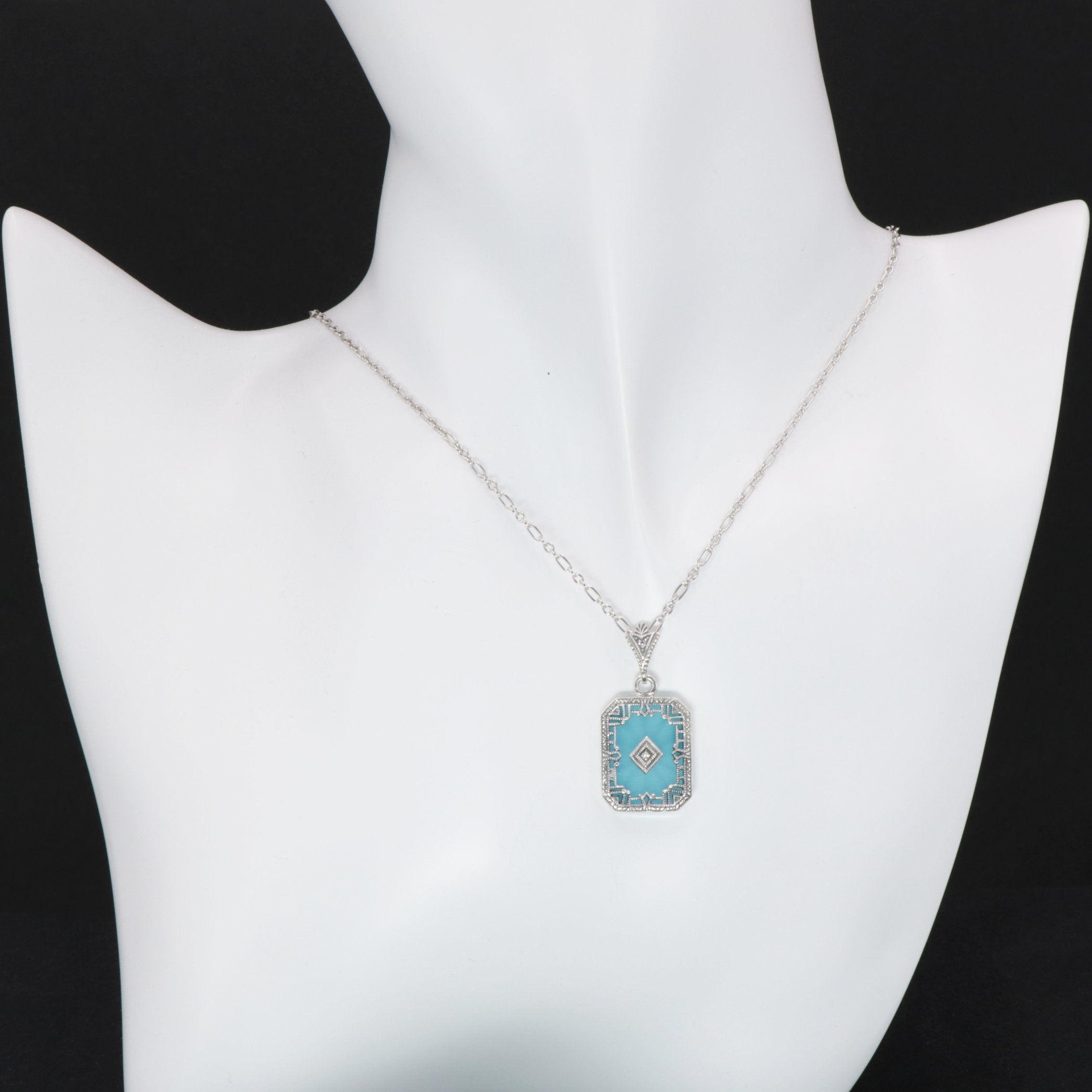 Detail view of Art Deco Style Filigree Pendant Teal Pressed Glass Crystal Diamond Accents Sterling Silver highlighting Diamon