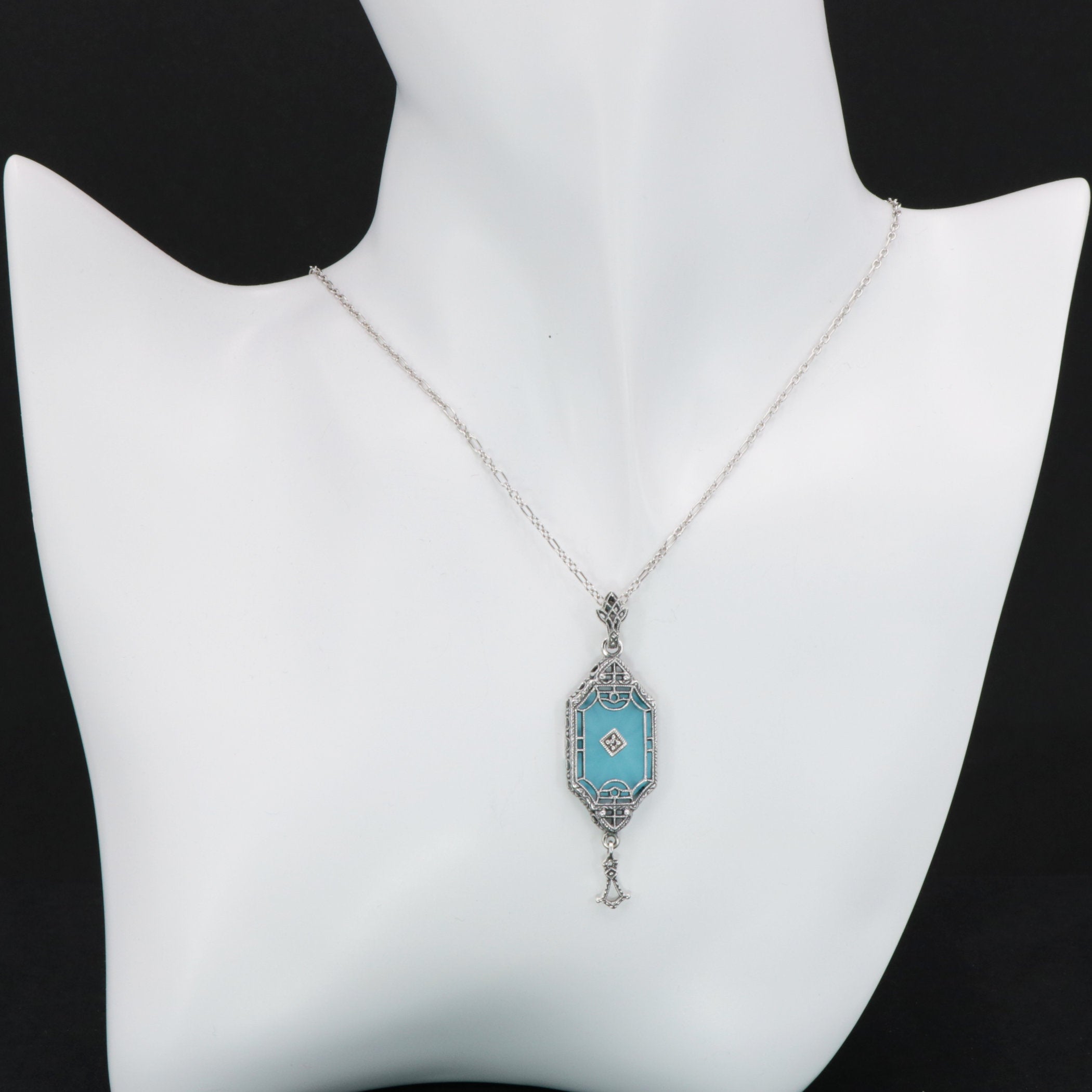 Detail view of Art Deco Style Teal Sunray Crystal Dangle Filigree Pendant Diamond Accent Sterling Silver highlighting Diamond