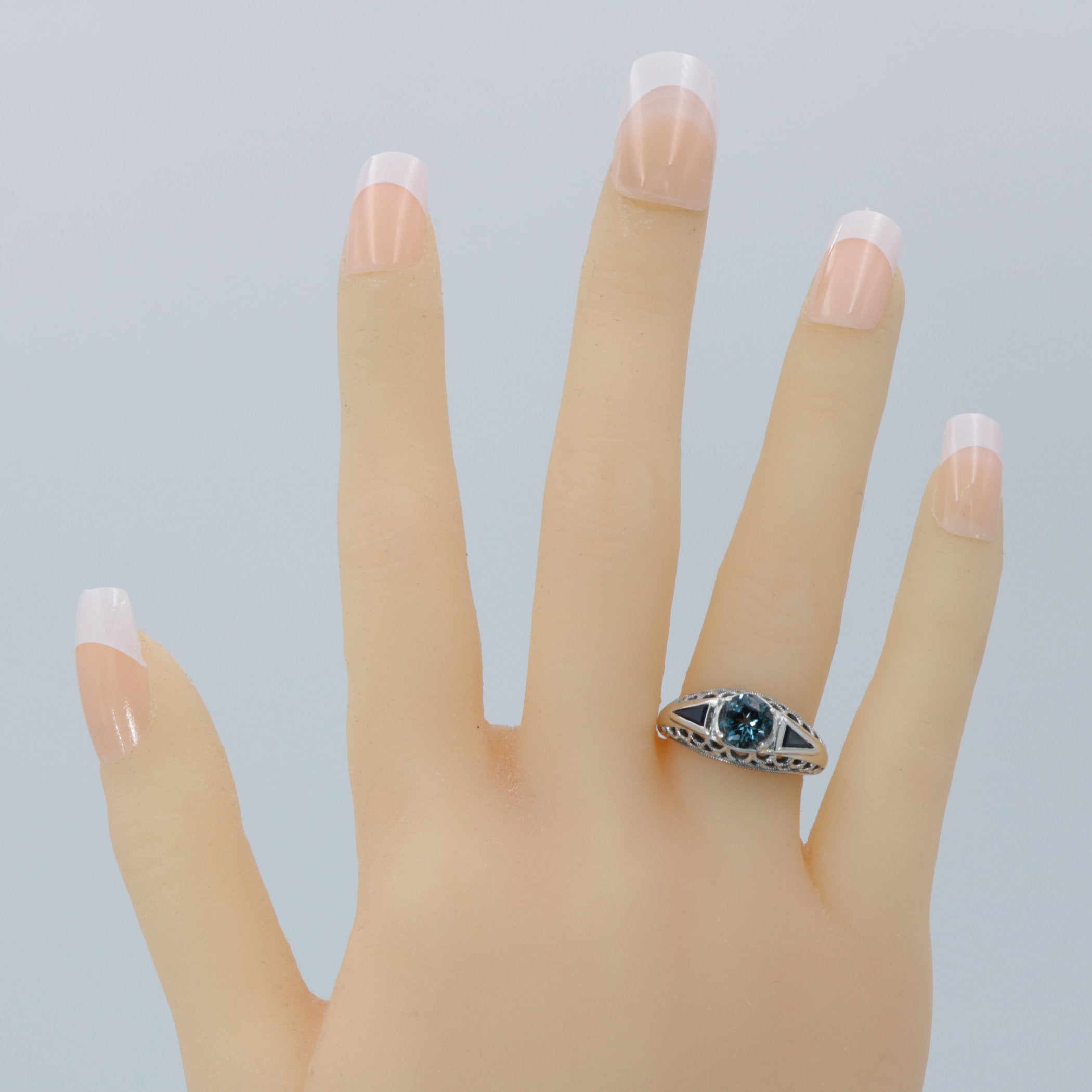 Detail view of Art Deco Filigree London Blue Topaz Ring with Natural Sapphire Accents Sterling Silver highlighting Blue Topaz