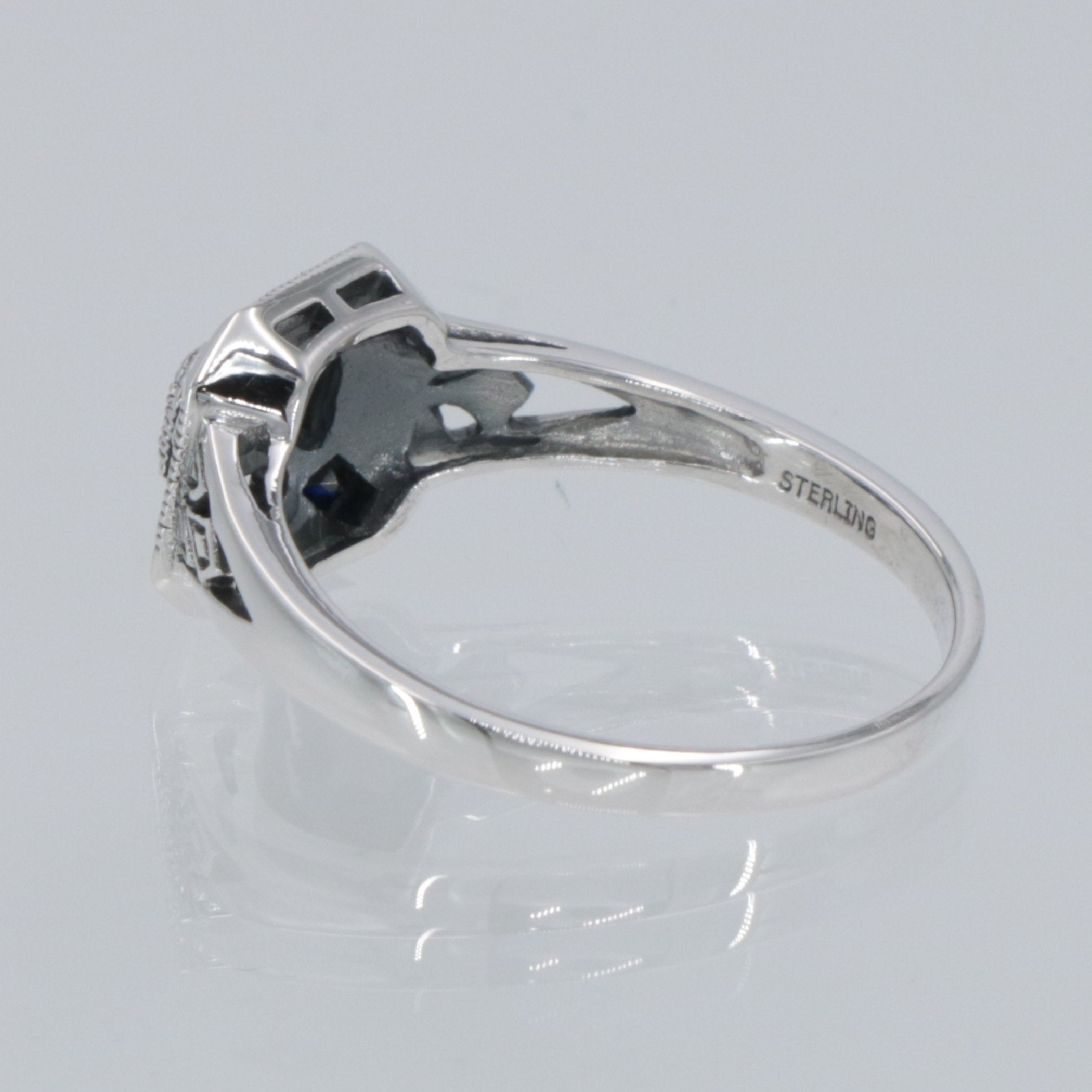 Detail view of White and Blue Sapphire Filigree Ring - Deco Style highlighting Sapphire