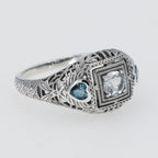 Detail view of Art Deco White Topaz Filigree Ring London Blue Topaz Accents Sterling Silver highlighting Blue Topaz, London B