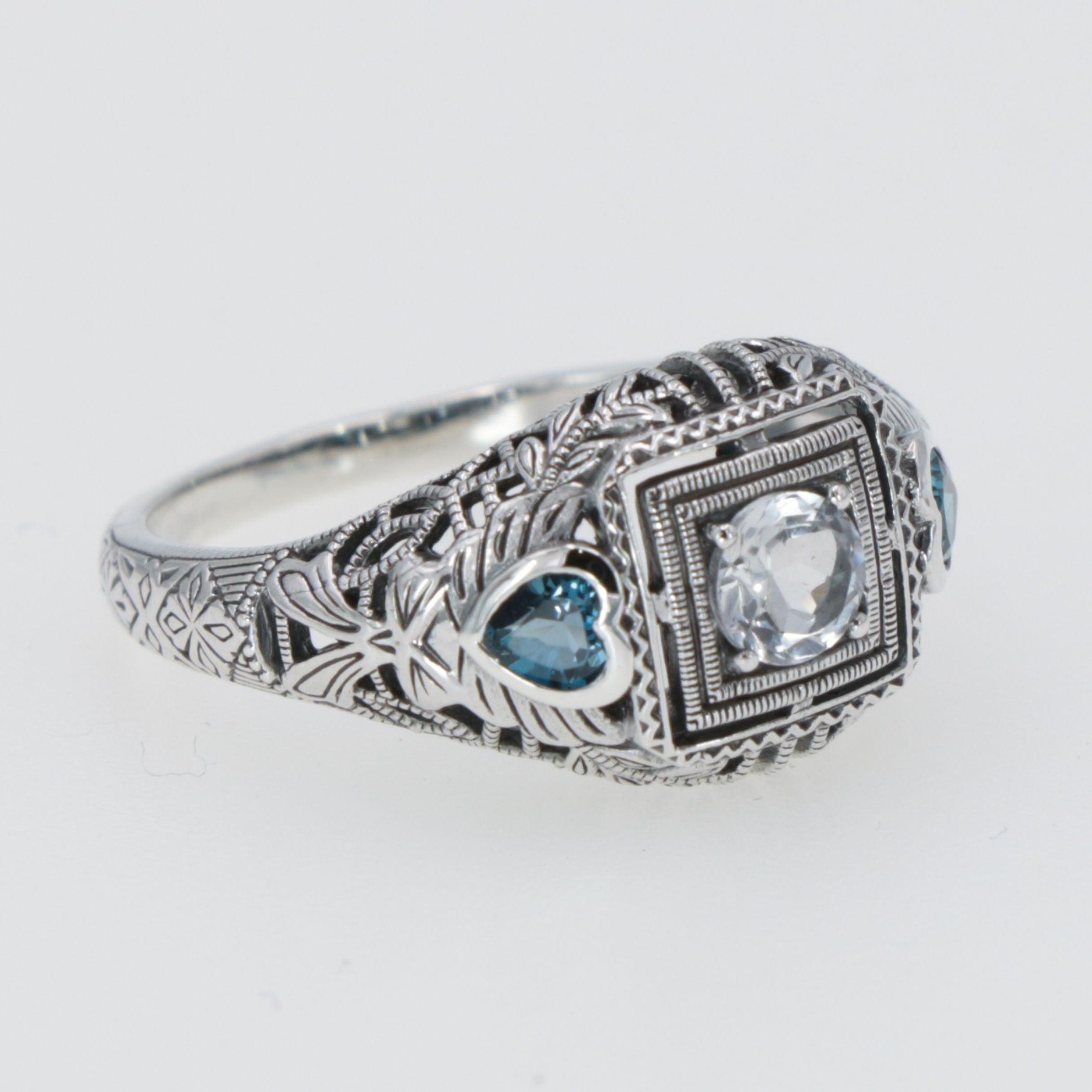 Detail view of Art Deco White Topaz Filigree Ring London Blue Topaz Accents Sterling Silver highlighting Blue Topaz, London B
