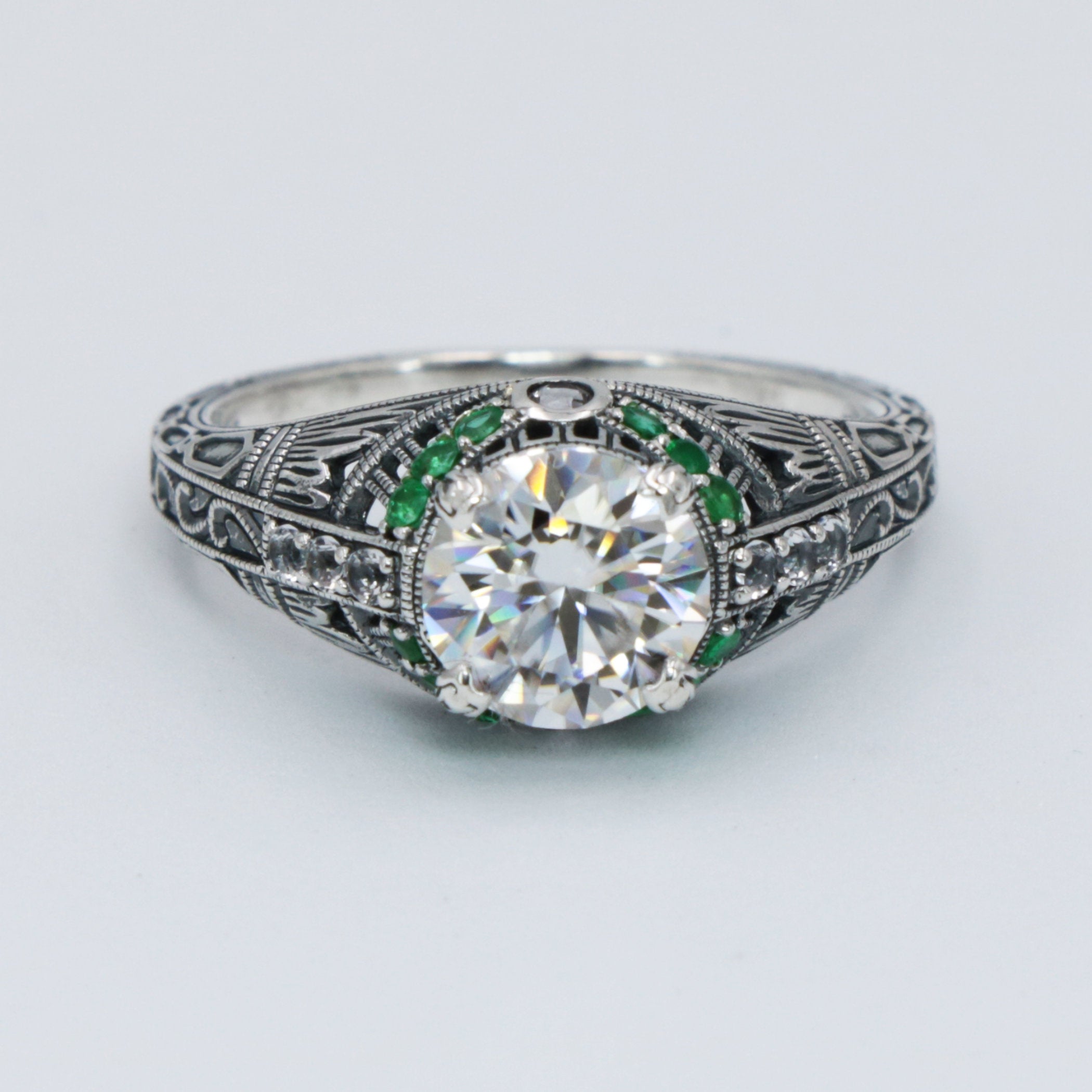 Back view of Art Deco Style White Topaz Filigree Ring Green Emerald Accents Sterling Silver showing 925 sterling silver hallm