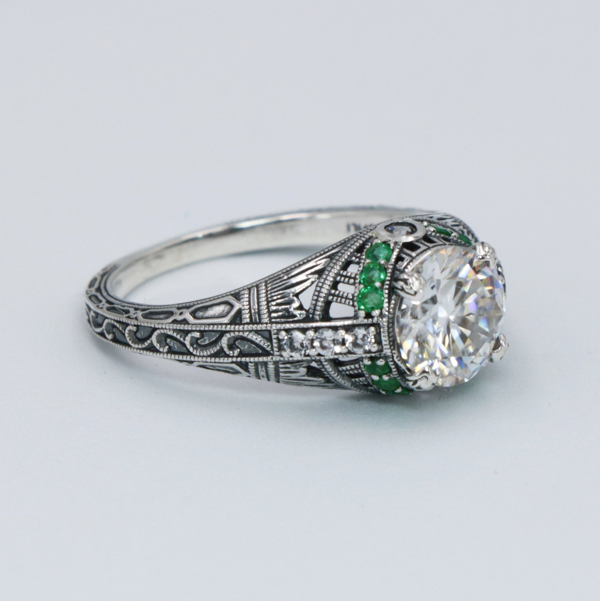 Detail view of Art Deco Style White Topaz Filigree Ring Green Emerald Accents Sterling Silver highlighting White Topaz, Emera