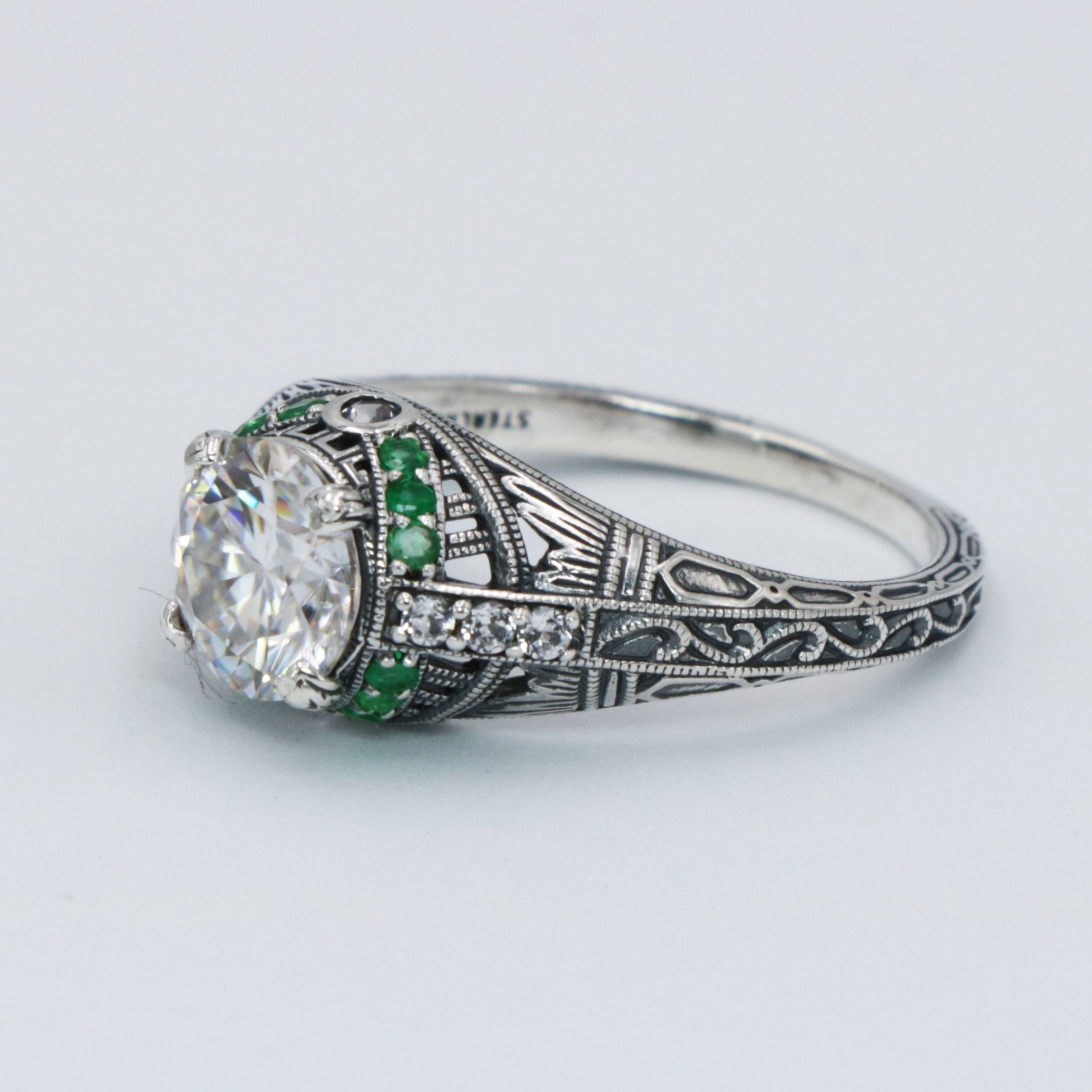Detail view of Art Deco Style White Topaz Filigree Ring Green Emerald Accents Sterling Silver highlighting White Topaz, Emera