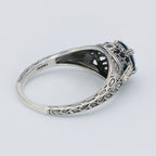 Detail view of Art Deco Style 7mm London Blue Topaz Filigree Ring w/ Sapphire and Topaz accents Sterling Silver highlighting 