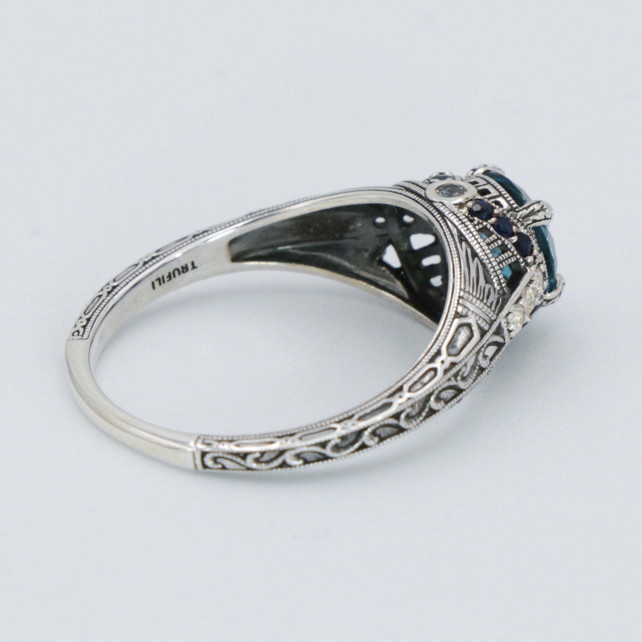 Detail view of Art Deco Style 7mm London Blue Topaz Filigree Ring w/ Sapphire and Topaz accents Sterling Silver highlighting 