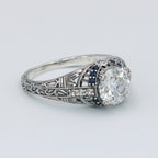 Detail view of Art Deco Style Moissanite Filigree Ring Blue Sapphire and White Topaz Accents Sterling Silver highlighting Whi