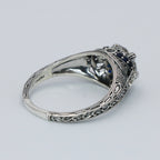 Detail view of Art Deco Style Moissanite Filigree Ring Blue Sapphire and White Topaz Accents Sterling Silver highlighting Whi