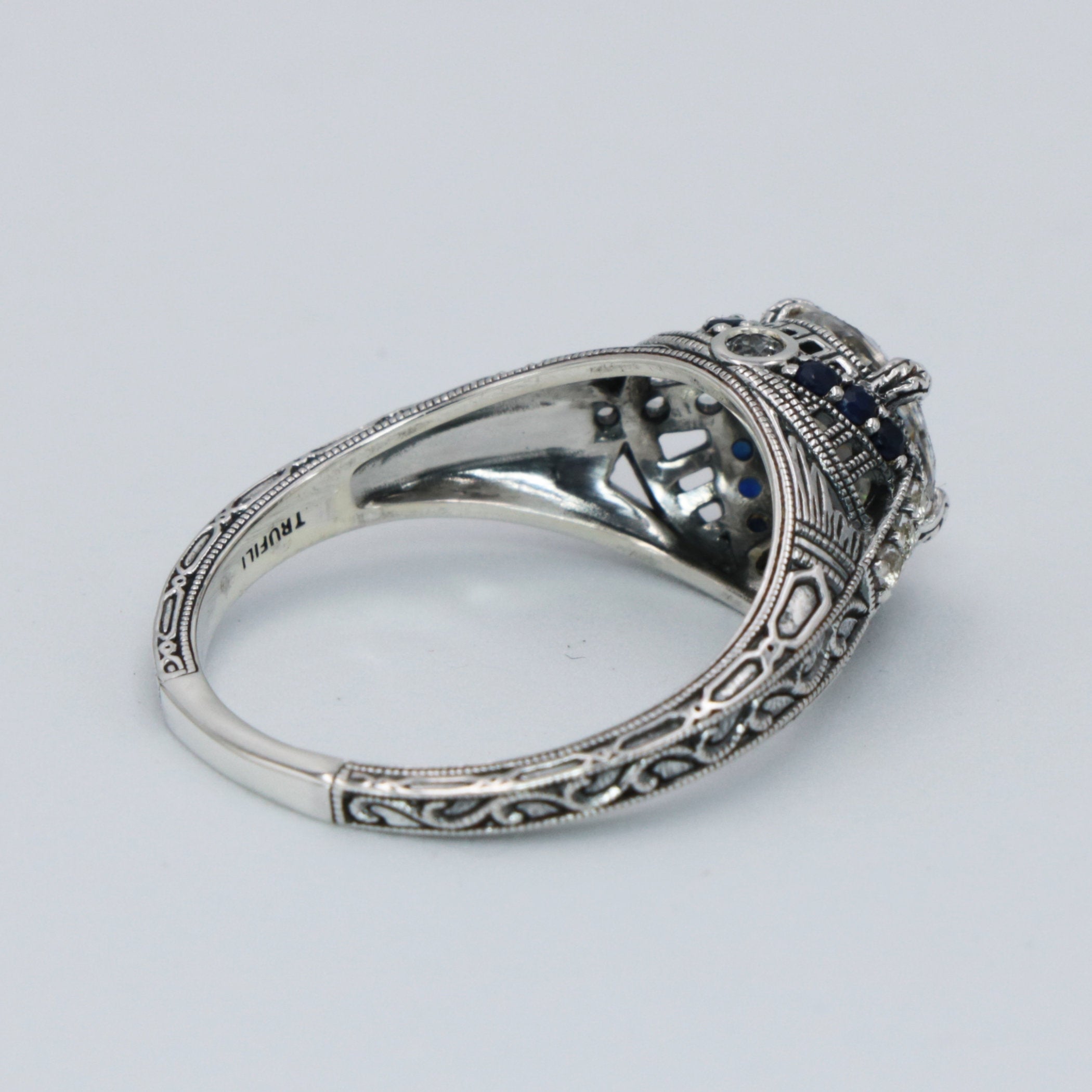 Detail view of Art Deco Style Moissanite Filigree Ring Blue Sapphire and White Topaz Accents Sterling Silver highlighting Whi