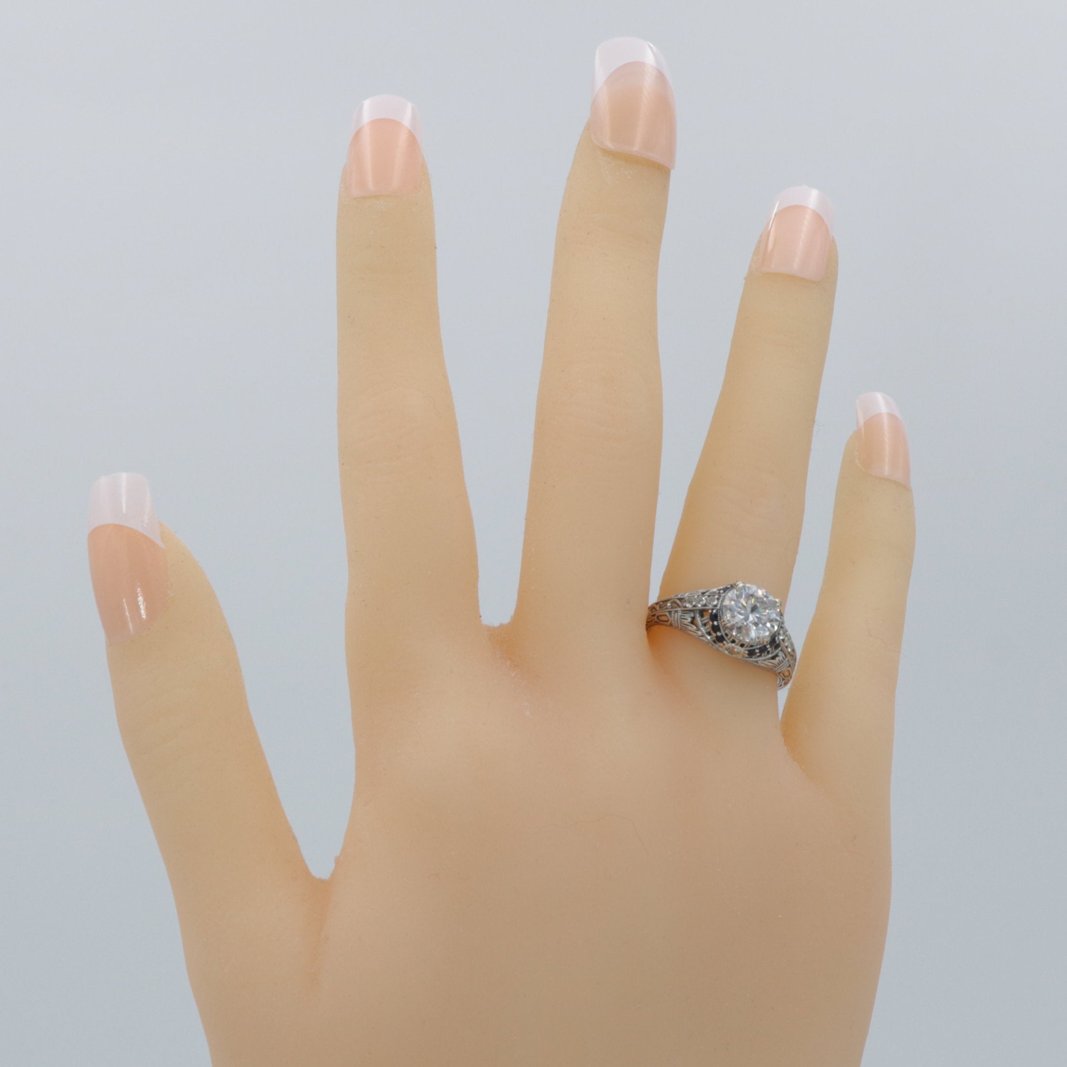 Detail view of Art Deco Style Moissanite Filigree Ring Blue Sapphire and White Topaz Accents Sterling Silver highlighting Whi