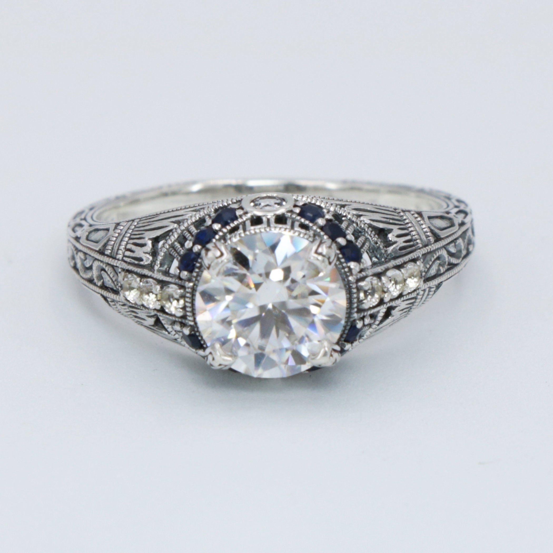 Back view of Art Deco Style White Topaz Filigree Ring w/ Blue Sapphire Sterling Silver showing 925 sterling silver hallmark