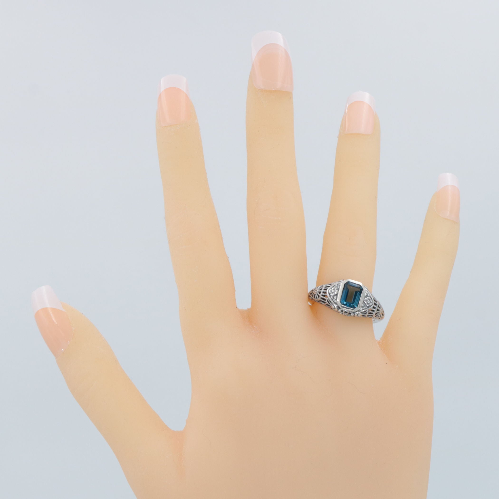 Detail view of Victorian Style London Blue Topaz Filigree Ring Floral Design Sterling Silver highlighting Blue Topaz, London 