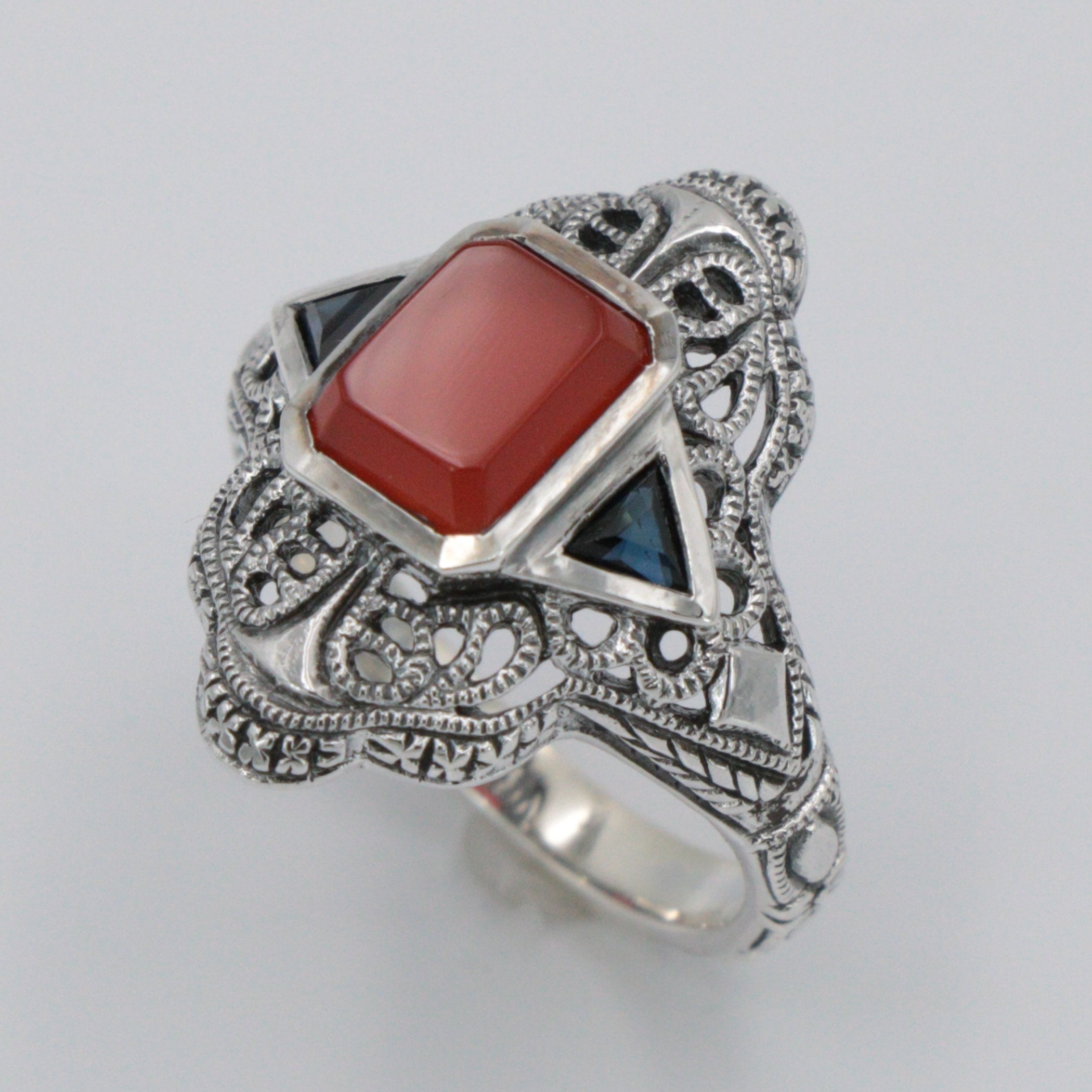 Detail view of Art Deco Red Carnelian Filigree Ring Sapphire Accents Sterling Silver highlighting Sapphire, Carnelian