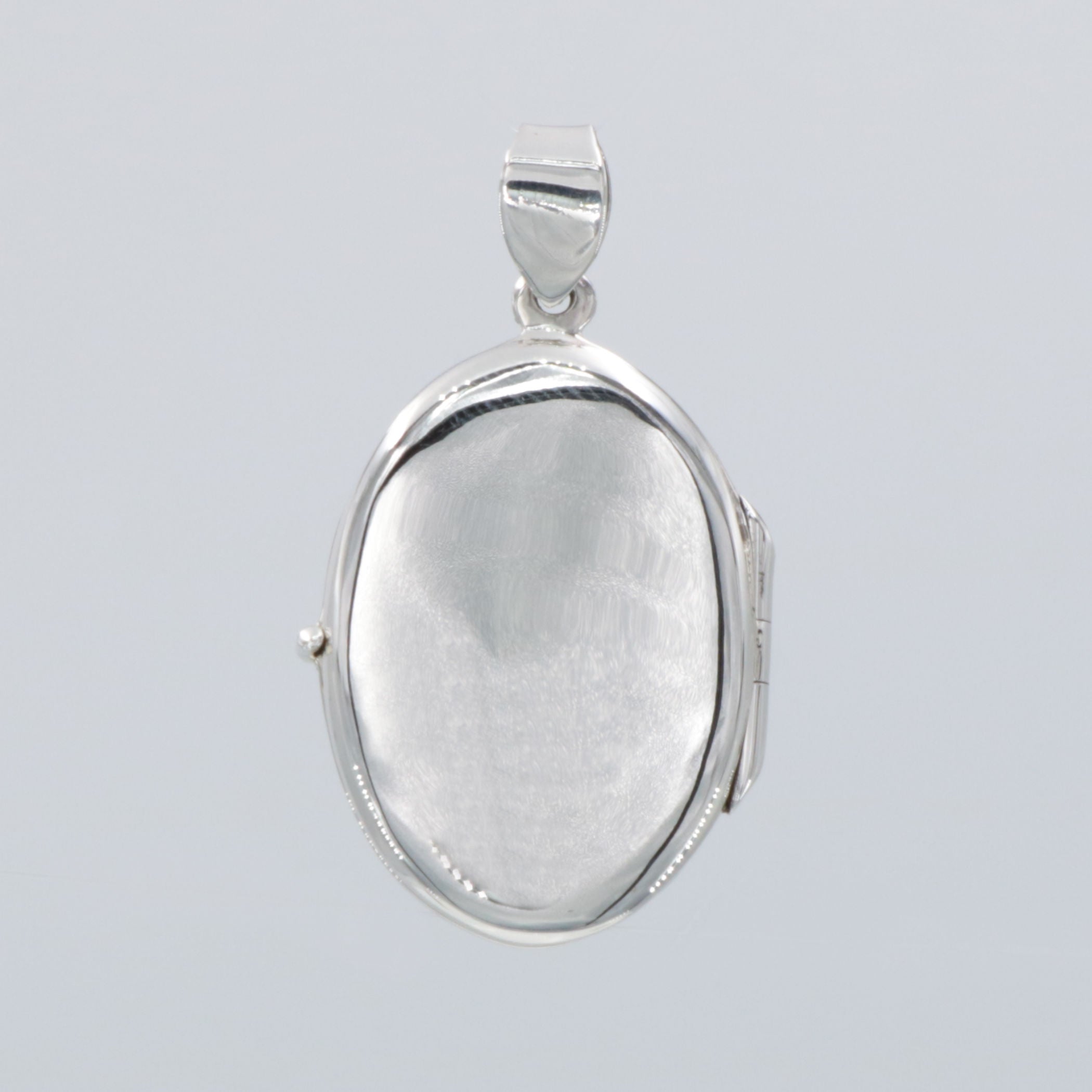 Back view of Fresh Water Mother of Pearl Oval Locket Pendant showing 925 sterling silver hallmark and spring ring clasp