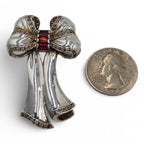Detail view of Fine Bead Set Marcasite Bow Pin or Brooch with Garnets highlighting Garnet, Marcasite