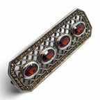 Back view of Fine Bead Set Marcasite Pin or Brooch with 4 Oval Faceted Garnets showing 925 sterling silver hallmark and pin b