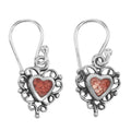 Sterling silver heart drop earrings with coral-pink stone inlay, oxidized silver scroll filigree border, French wire hooks