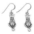 Sterling silver openwork filigree sitting cat dangle earrings, scroll patterned body, curled tail, French wire hooks