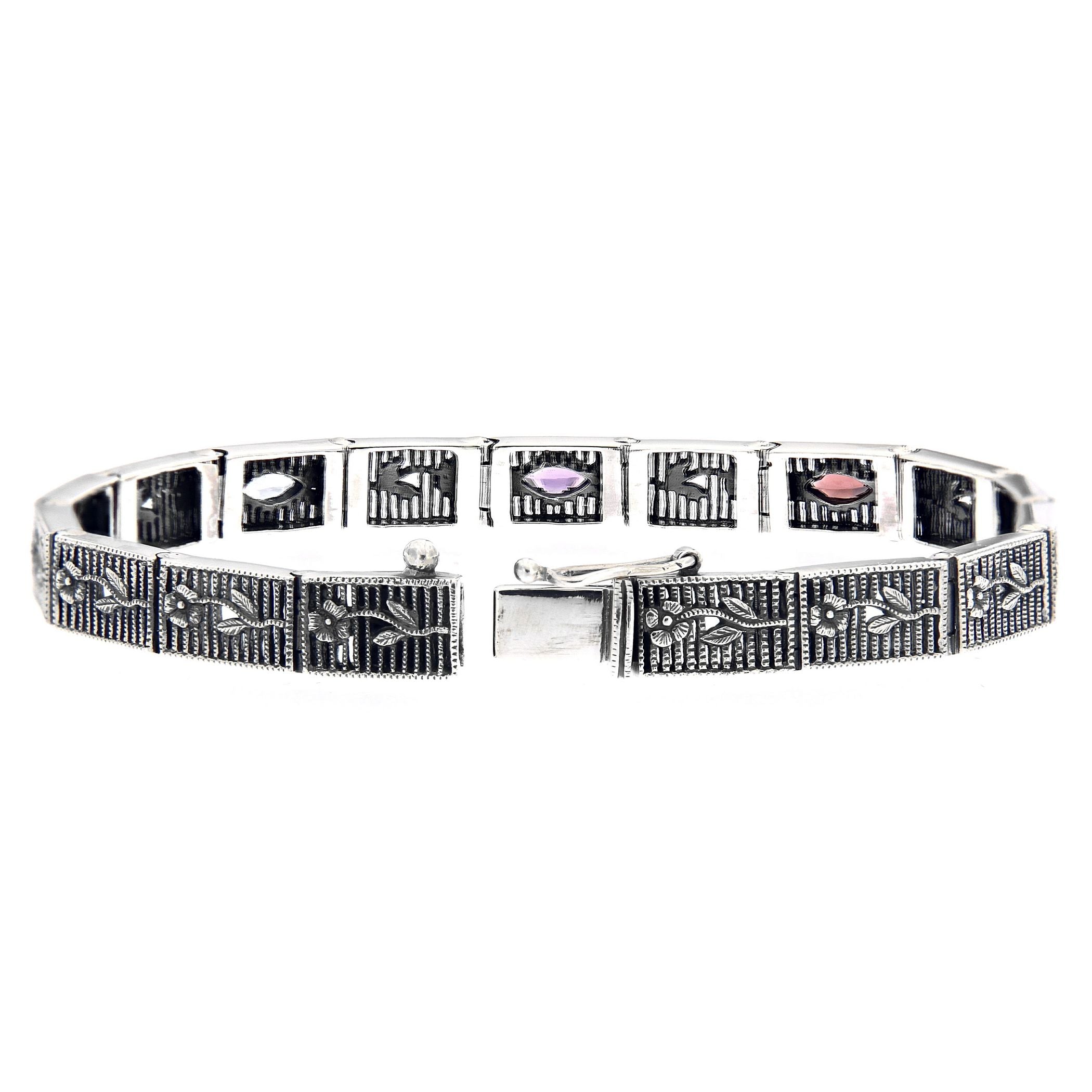 Back view of Victorian Style Blue Topaz Amethyst and Garnet Filigree Bracelet Silver showing 925 sterling silver hallmark and