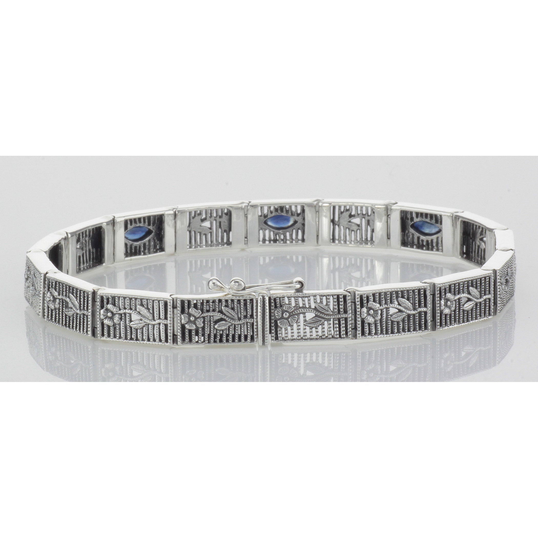 Detail view of Victorian Style Floral Blue Sapphire Filigree Link Bracelet Sterling Silver highlighting Sapphire
