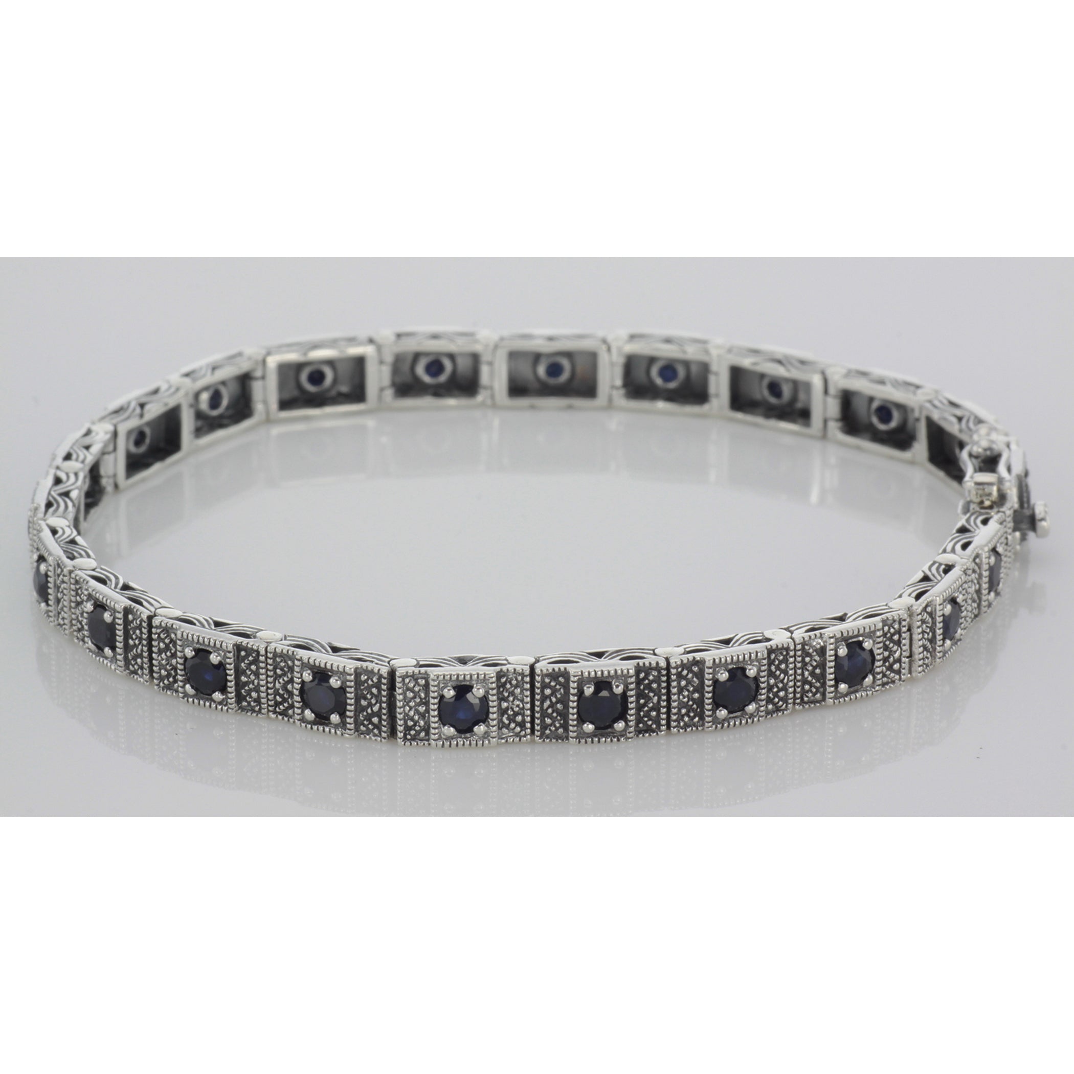 Detail view of Victorian Style Sapphire Filigree Link Bracelet in fine Sterling Silver highlighting Sapphire