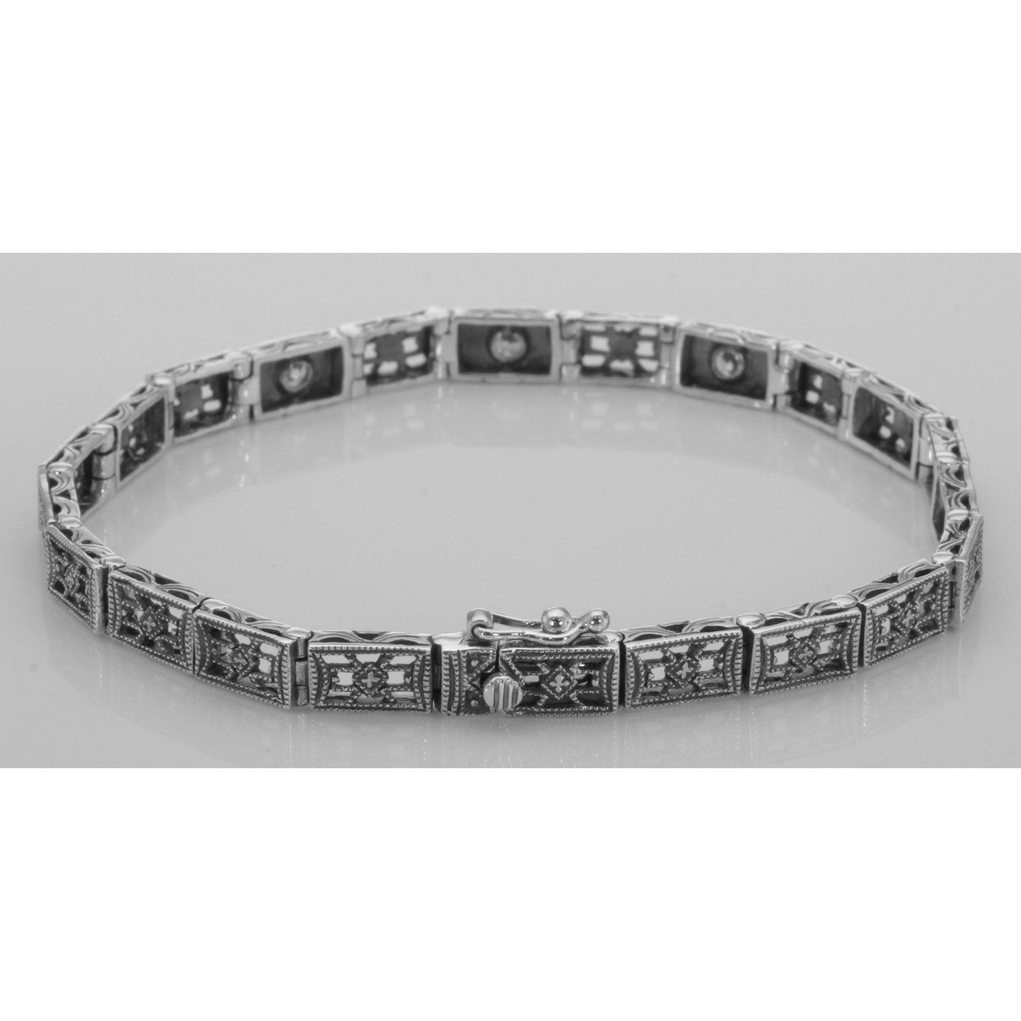 Detail view of Victorian Style 3 Stone White Topaz Filigree Bracelet in Fine Sterling Silver highlighting White Topaz