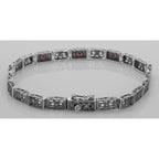 Detail view of Victorian Style 3 Stone Red Garnet Filigree Bracelet in Fine Sterling Silver highlighting Garnet