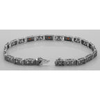 Back view of Victorian Style 3 Stone Red Garnet Filigree Bracelet in Fine Sterling Silver showing 925 sterling silver hallmar